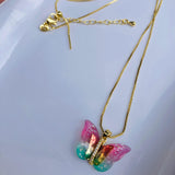 Collar mariposa transformación rosa/menta