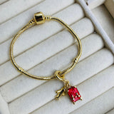 Charm Maleta Dorada