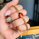 Pulsera mariquita dorada
