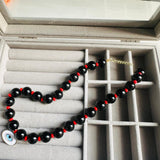Collar negro corazón instinto