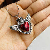 Collar corazon alas plateado