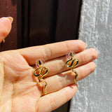Topos Serpiente gold
